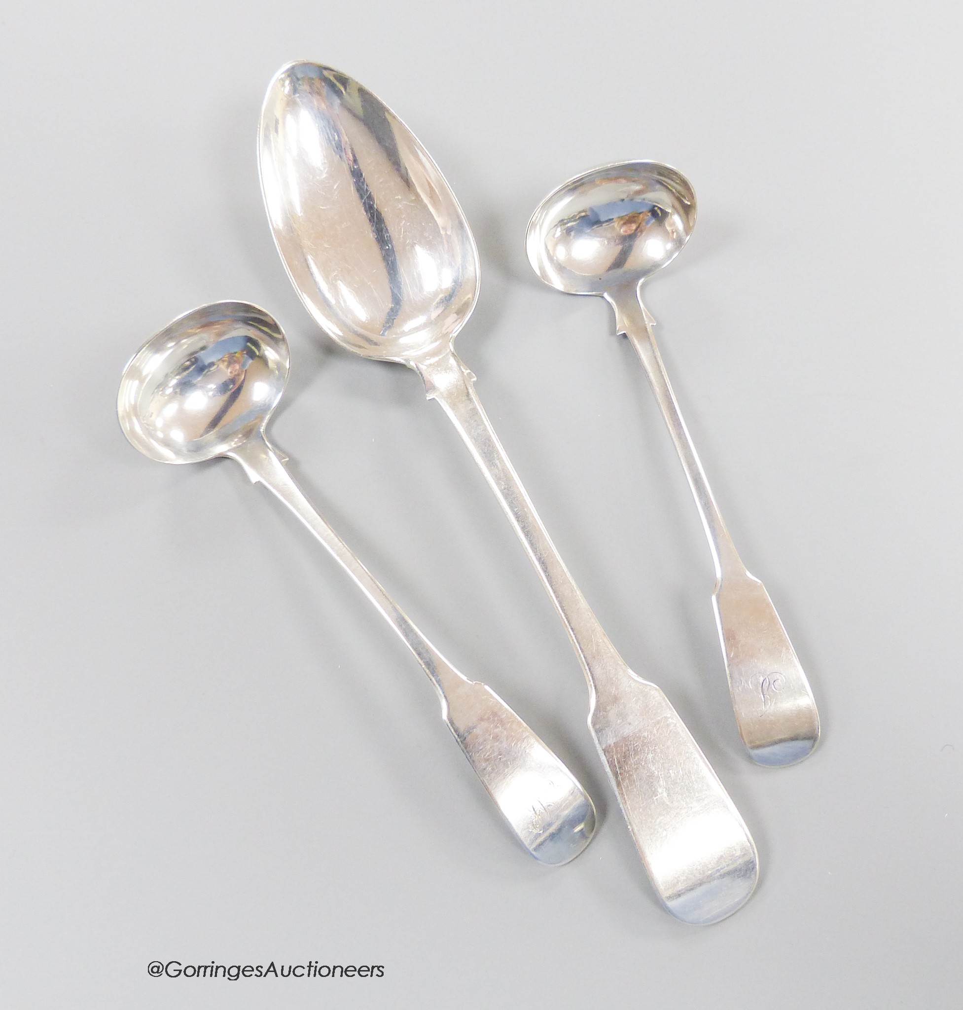 A 19th century Scottish provincial fiddle pattern table spoon, 22.3cm and two similar toddy ladles, Andrew Davidson, Arbroath, c.1835, 123 grams.